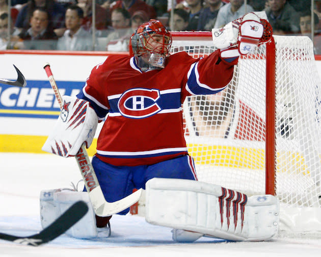 MONTREAL- APRIL 26: Jaroslav Halak #41 of the Montreal Canadiens makes a glove save on the puck in Game Six of the Eastern Conference Quarterfinals against the Washington Capitals during the 2010 NHL Stanley Cup Playoffs at the Bell Centre on April 26, 2010 in Montreal, Quebec, Canada. The Canadiens defeated the Capitals 4-1 tying the series 3-3. (Photo by Richard Wolowicz/Getty Images)