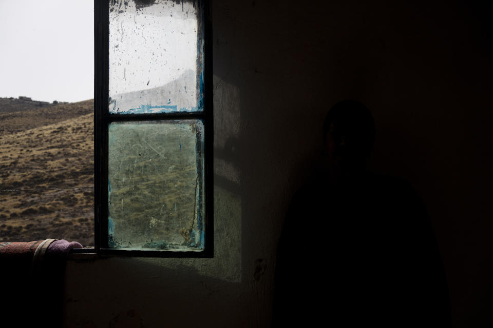 A bedroom window is seen in a Palestinian herding hamlet in the South Hebron Hills, West Bank, Friday, May 17, 2024 -- showing that shepherds have a view of an Israeli settlement. Palestinians say they are restricted by Israeli settlers from grazing land and face harassment, intimidation and violence. (AP Photo/Maya Alleruzzo)