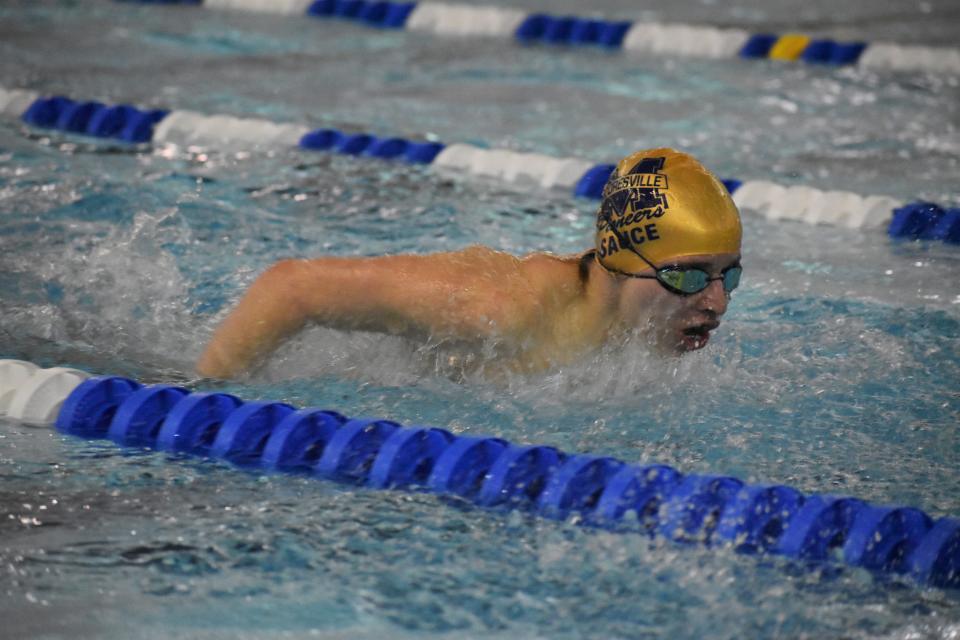 Mooresville swimmer Karl Russell competes in the 100-yard butterfly during sectional preliminaries at Franklin Community High School on Feb. 17, 2022.