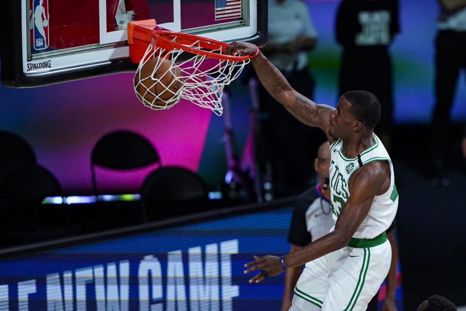 Boston Celtics guard Javonte Green (43) gets a dunk against the Brooklyn Nets during the second half of an NBA basketball game Wednesday, Aug. 5, 2020 in Lake Buena Vista, Fla. (AP Photo/Ashley Landis)