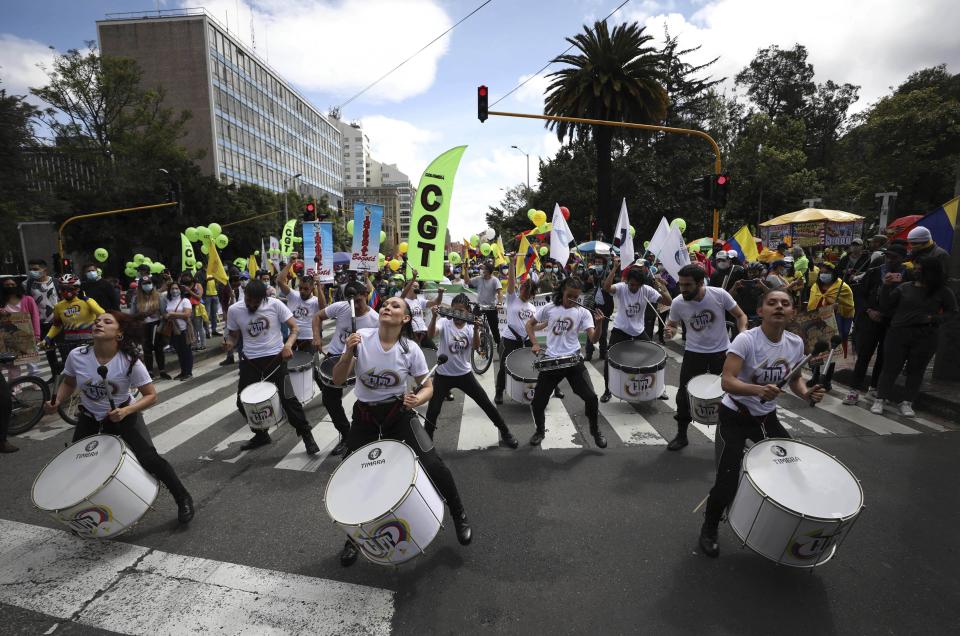 A music group plays drums during an anti-government march in Bogota, Colombia, Wednesday, May 12, 2021. (AP Photo/Fernando Vergara)