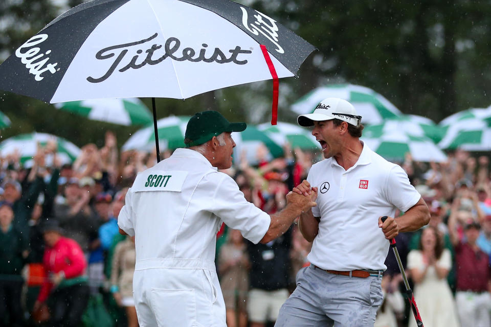 Pictured left to right, Caddie Steve Williams celebrating with Adam Scott after the Aussie won the 2013 Masters. 