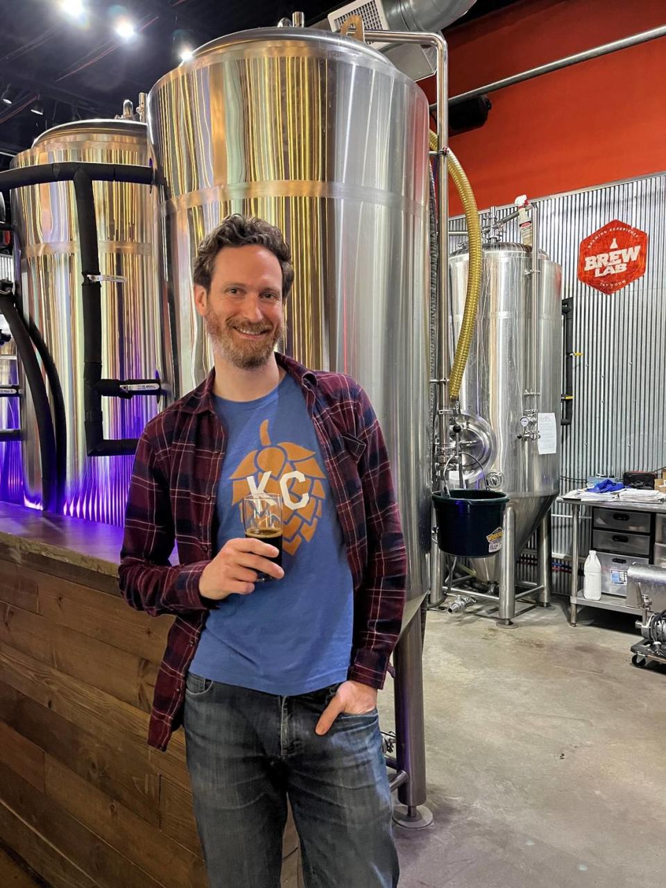 Craft for Climate Kansas City spokesperson Jeremy Hogan wearing a hops-themed shirt from the organization at Brew Labs in Overland Park.