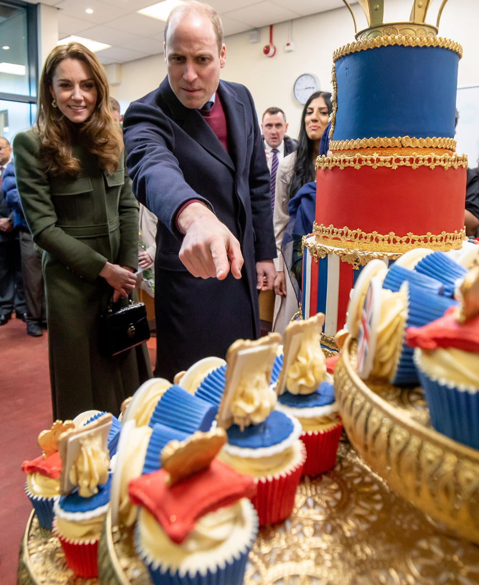 Britain's Prince William, Duke of Cambridge and Britain's Catherine, Duchess of Cambridge react during their visit to the Khidmat Centre in Bradford on January 15, 2020, to learn about the activities and workshops offered by the centre. (Photo by Charlotte Graham / POOL / AFP) (Photo by CHARLOTTE GRAHAM/POOL/AFP via Getty Images)