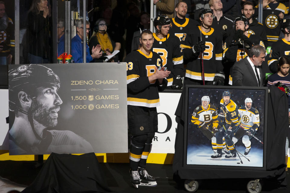 Boston Bruins' Zdeno Chara is honored before their NHL hockey game against the Arizona Coyotes for playing in his 1,500th NHL game and his 1,000th game as captain of the Boston Bruins during the first period of an NHL hockey game Saturday, Feb. 8, 2020, in Boston. (AP Photo/Winslow Townson)