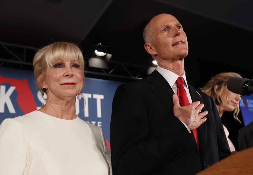 Republican Senate candidate Rick Scott speaks with his wife Ann by his side at an election watch party, Wednesday, Nov. 7, 2018, in Naples, Fla. (AP Photo/Wilfredo Lee)