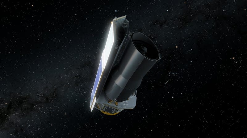 An artistic rendering of the Spitzer Space Telescope hanging in space. The Telescope is cylindrical with a row of solar panels on its side illuminated by the sun. Stars are in the background. 