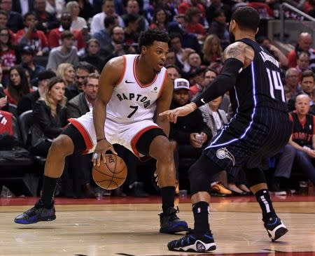 Apr 23, 2019; Toronto, Ontario, CAN; Toronto Raptors guard Kyle Lowry (7) dribbles the ball against Orlando Magic guard D.J. Auguastin (14) in the second half in game five of the first round of the 2019 NBA Playoffs at Scotiabank Arena. Mandatory Credit: Dan Hamilton-USA TODAY Sports