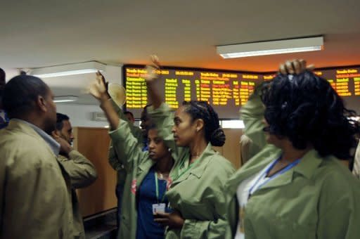 Coffee traders shop for deals on the floor of the Ethiopian Commodities Exchange (ECX) in Addis Ababa on May 31, 2013. While not all coffee, beans and sesame produced are traded on the ECX -- they are also sold through farming cooperatives or at auction houses -- about 90 percent of these three items move through the commodities exchange