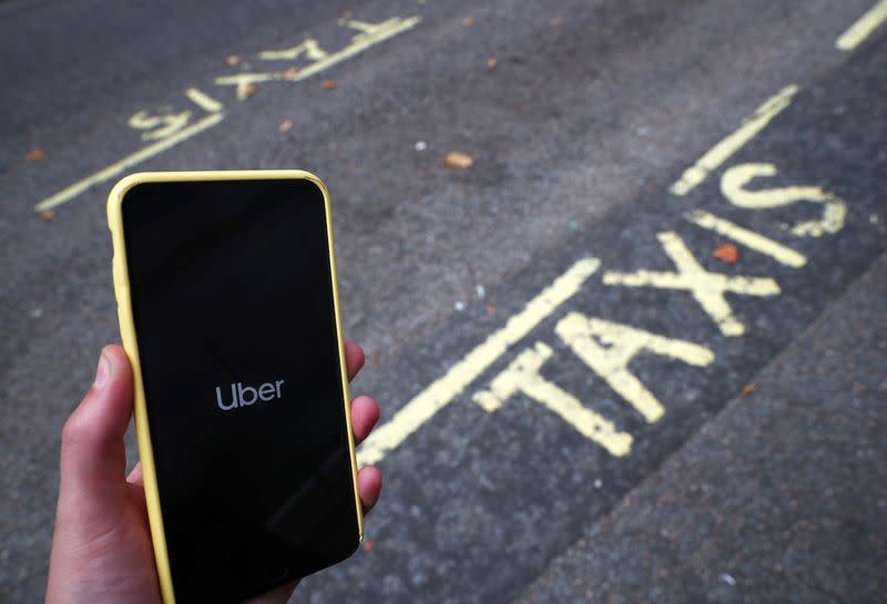 The Uber application is seen on a mobile phone in London