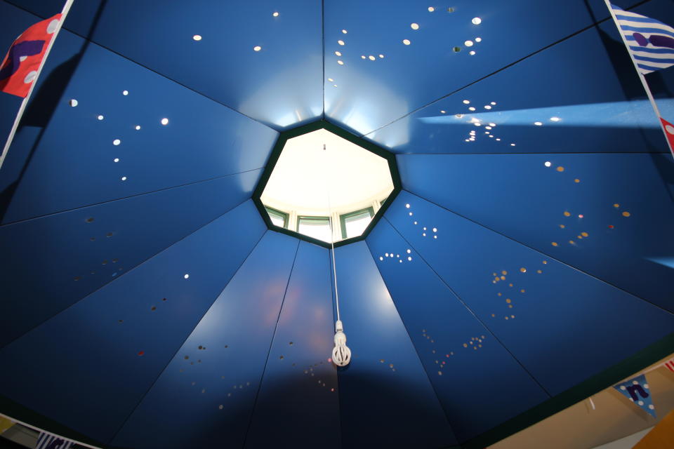 A blue-painted canopy pierced by circles arranged in the shape of zodiac constellations at the Bishop Wilson Memorial Library. (G Waters/PA)