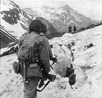 U.S. troops navigate snow and ice during the battle on Attu in May 1943.