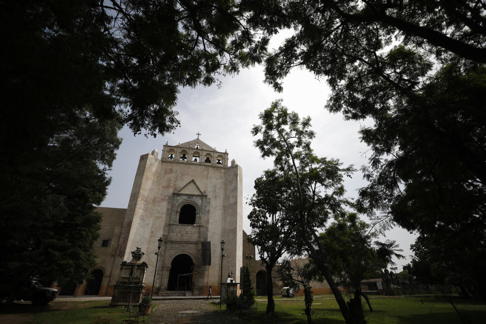 The reconstructed bell gable and repaired church facade stand at the former San Juan Bautista Convent, where restoration work is underway following damage in a 2017 earthquake, in Tlayacapan, Morelos state, Mexico, Tuesday, Oct. 13, 2020. The barrel-vault roof from the 1500s cracked and partly collapsed in the 2017 quake. (AP Photo/Rebecca Blackwell)