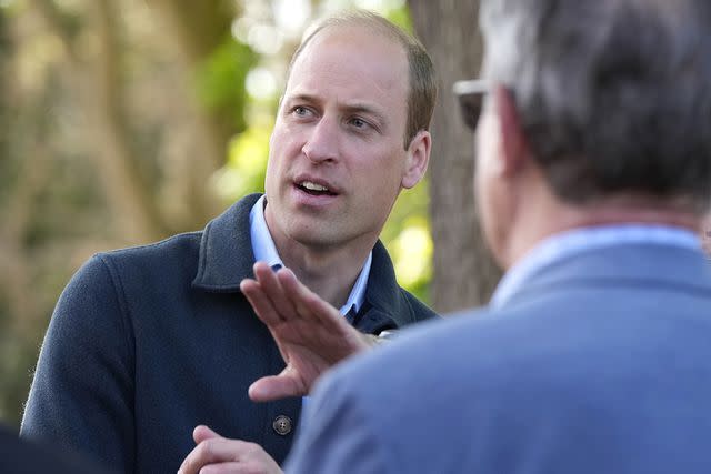 <p>AP Photo/Alastair Grant</p> Prince William is greeted as he arrives for a visit to Surplus to Supper