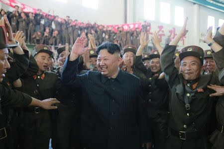 North Korean leader Kim Jong Un reacts with scientists and technicians of the DPRK Academy of Defence Science after the test-launch of the intercontinental ballistic missile Hwasong-14 in this undated photo released by North Korea's Korean Central News Agency (KCNA) in Pyongyang July 5, 2017. KCNA/via REUTERS/Files