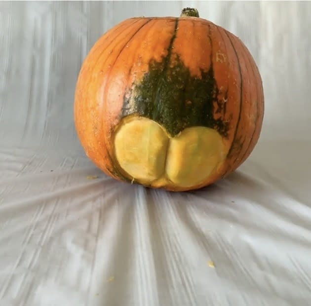 A butt carved into a pumpkin