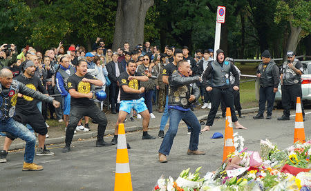 Members of a New Zealand biker gang perform the Haka to honour the victims of the mosque shootings in Christchurch, New Zealand, March 17, 2019. REUTERS/Joseph Campbell