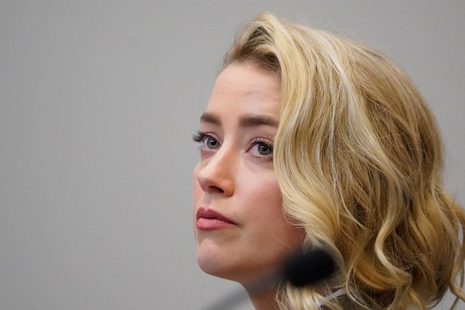 Actor Amber Heard listens in the courtroom at the Fairfax County Circuit Courthouse in Fairfax, Va., Monday, May 23, 2022.