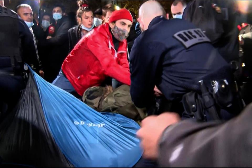 Officers were filmed pulling up tents