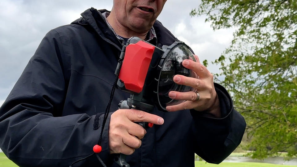 Joby SeaPal waterproof case held in a pair of hands