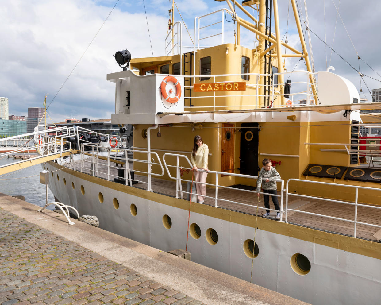 Julia and Danilo Martyshkina stand aboard the M.L.V Castor