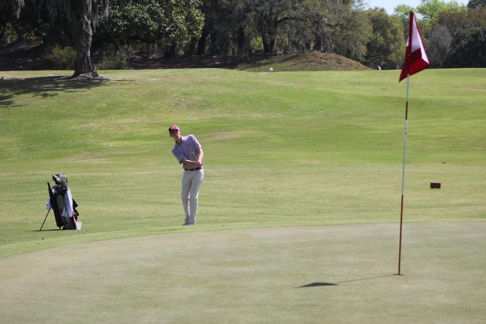 Benedictine freshman Jack Weeks make a chip that set up a par save at Savannah Golf Club in the Georgia South Carolina Cup on March 24, 2024.