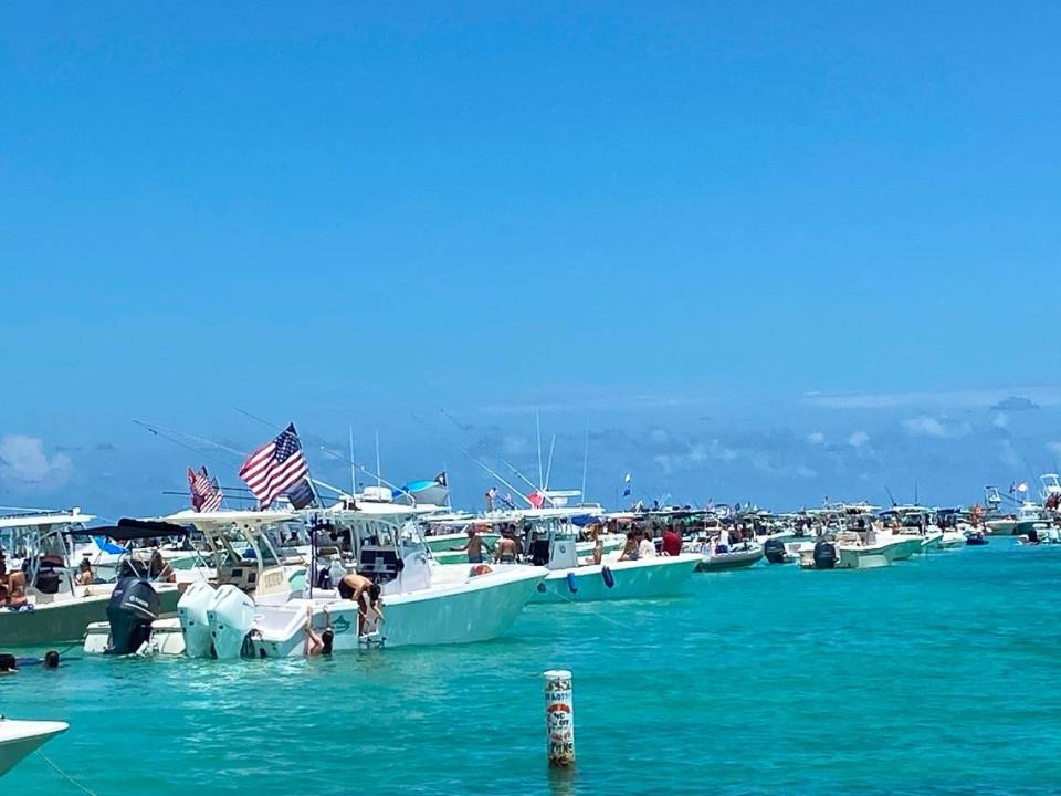 Dozens of boats anchor on the sandbar off Windley Key in the Florida Keys Sunday, May 30, 2021.