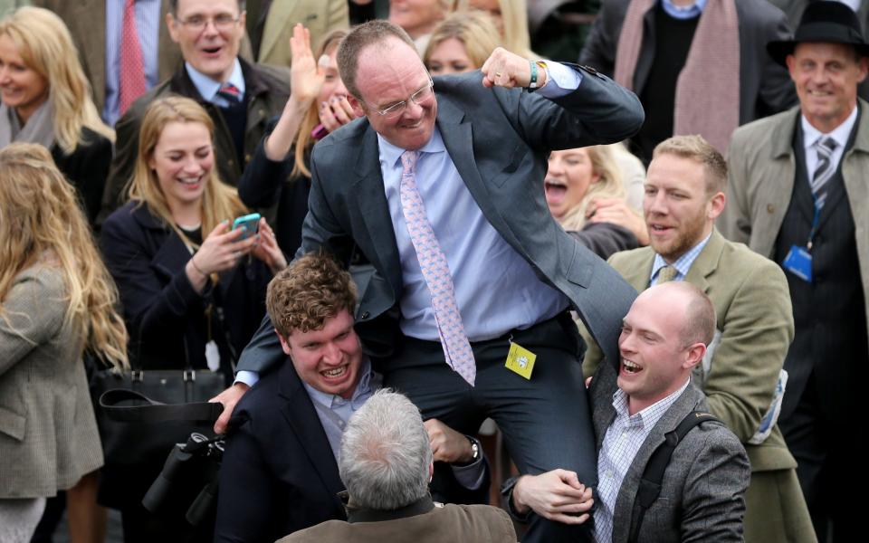 Richard Newland celebrates Pineau De Re's victory in the 2014 Grand National  - GETTY IMAGES