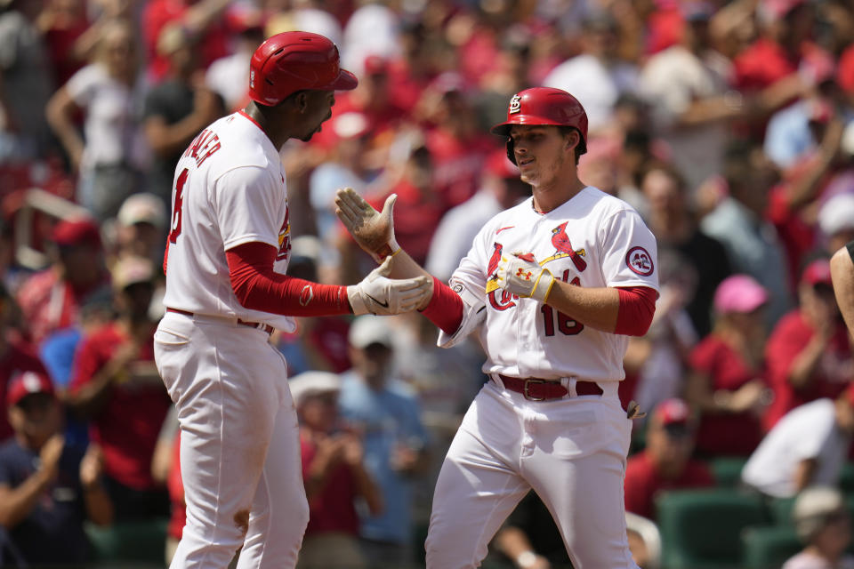 St. Louis Cardinals' Nolan Gorman, right, is congratulated by teammate Jordan Walker after hitting a grand slam during the sixth inning of a baseball game against the Arizona Diamondbacks Wednesday, April 19, 2023, in St. Louis. (AP Photo/Jeff Roberson)