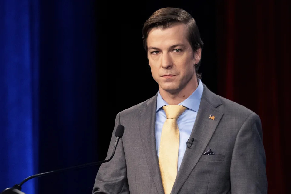 FILE - Libertarian Chase Oliver, candidate for Georgia's U.S. Senate seat, listens during a debate, Oct. 16, 2022, in Atlanta, Ga. The Libertarian Party on Sunday, May 26, 2024, nominated party activist Oliver for president, rejecting former President Donald Trump and Robert F. Kennedy Jr. after they each spoke at the party's convention. (AP Photo/Ben Gray, File)