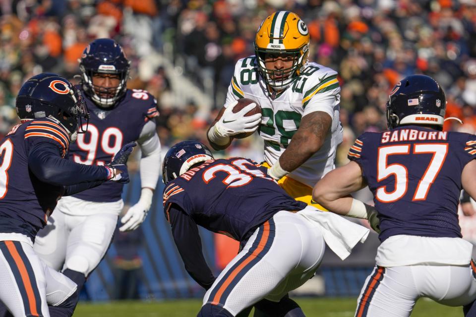 Green Bay Packers' AJ Dillon runs during the first half of an NFL football game against the Chicago Bears Sunday, Dec. 4, 2022, in Chicago. (AP Photo/Nam Y. Huh)