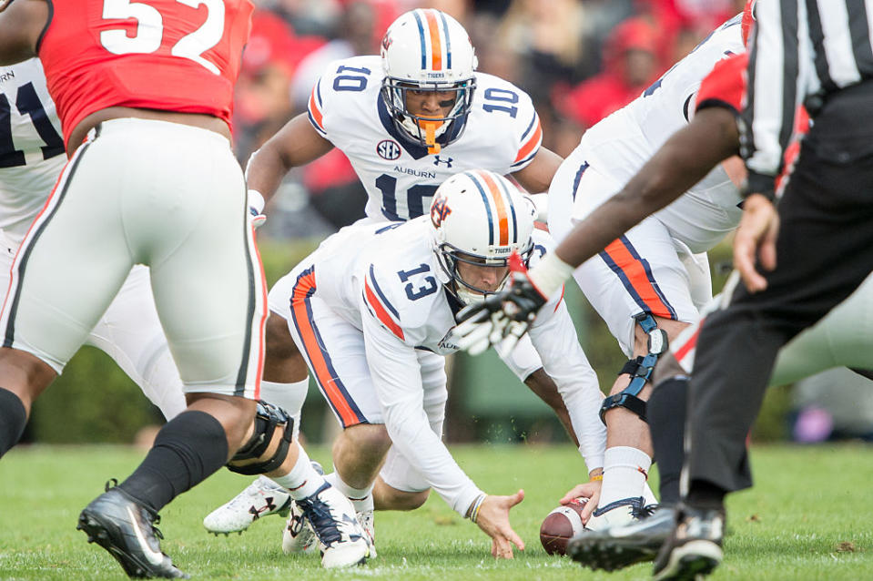 Auburn quarterback Sean White suffered a shoulder injury early in the loss against Georgia and didn't tell coaches. (Getty)