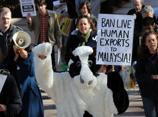 Protesters oppose Australia's plan to send asylum-seekers to Malaysia, in Sydney in June. Australia's High Court has dealt a heavy blow to the government by blocking the plans, ruling they could not go to a nation lacking legal safeguards