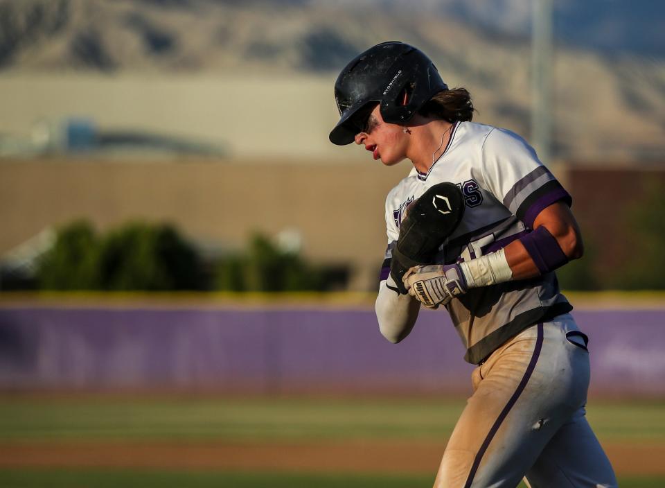 Shadow Hills' Jason Alvarez (15) jogs for the dugout after scoring a run during their round-one CIF-SS game at Shadow Hills High School in Indio, Calif., Thursday, May 4, 2023. 