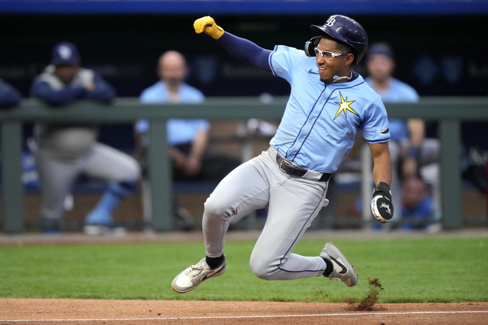Tampa Bay Rays' Richie Palacios slides home to score on a wild pitch thrown by Kansas City Royals starting pitcher Brady Singer during the second inning of a baseball game Tuesday, July 2, 2024, in Kansas City, Mo. (AP Photo/Charlie Riedel)