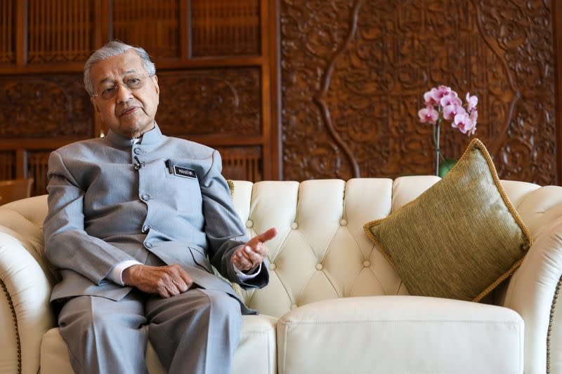 Malaysia's Prime Minister Mahathir Mohamad speaks during an interview with Reuters in Putrajaya