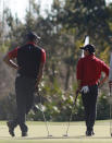 <p>The "hand on hip, lean on club" is a Woods trademark. </p>