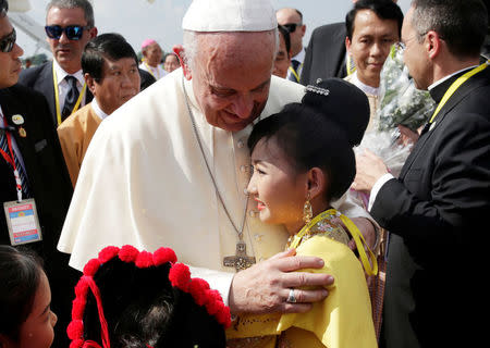 Pope Francis is welcomed as he arrives at Yangon International Airport, Myanmar November 27, 2017. REUTERS/Max Rossi