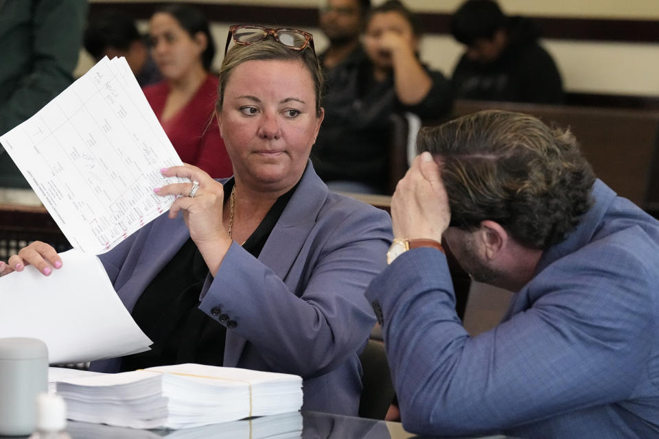 Nashville assistant district attorney Joanna Thomson, left, speaks with attorney Worrick Robinson, who represents Country music artist Morgan Wallen, during a hearing Friday, May 3, 2024, in Nashville, Tenn. Wallen waived his right to appear at the hearing following his April arrest on three felony counts of reckless endangerment and one misdemeanor count of disorderly conduct for throwing a chair off the roof of a downtown bar. (AP Photo/George Walker IV via Pool)