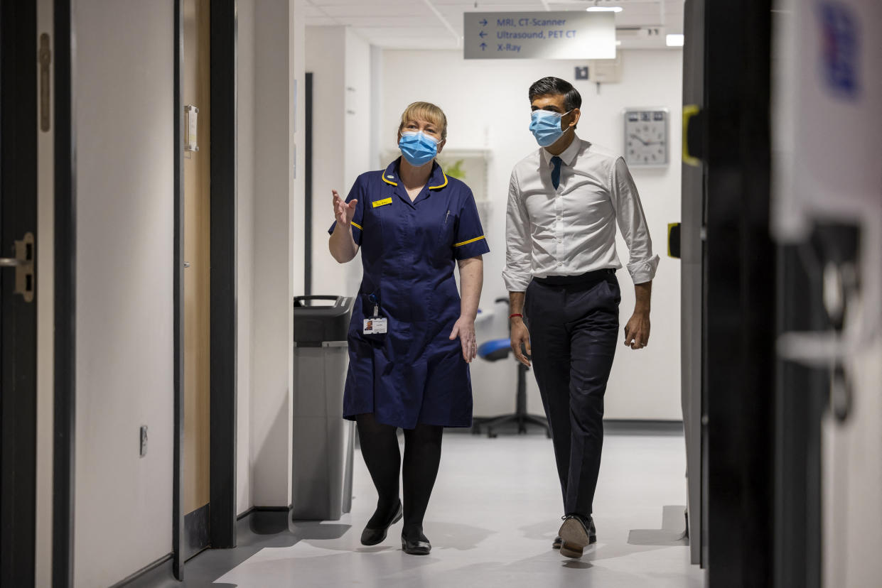 Britain's Prime Minister Rishi Sunak (R) walks with Kay Miller (L), Divisional Director of Nursing during a visit to Oldham Community Diagnostic Centre in north-west England on February 13, 2023. (Photo by James Glossop / POOL / AFP) (Photo by JAMES GLOSSOP/POOL/AFP via Getty Images)