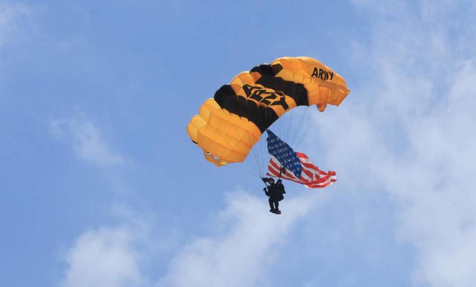 A member of the U.S. Army Golden Knights Parachute Team flies over South Beach at the Hyundai Air & Sea Show 2023 in Miami Beach on Saturday, May 27, 2023.