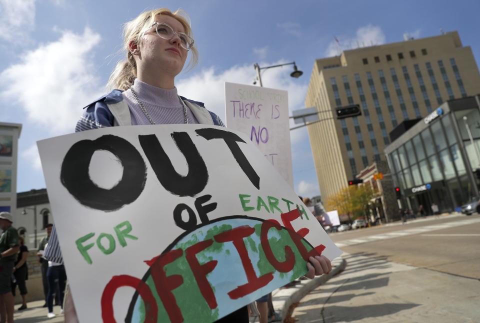 Kelly Jones joins a crowd at Houdini Plaza during a 2019 Global Climate Strike in Appleton.