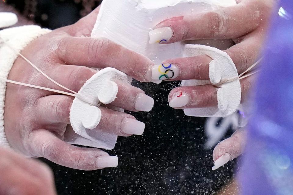 U.S. gymnast Suni Lee wears Olympic rings on her nails during podium training at the Ariake Gymnastics Center on July 22, 2021. 