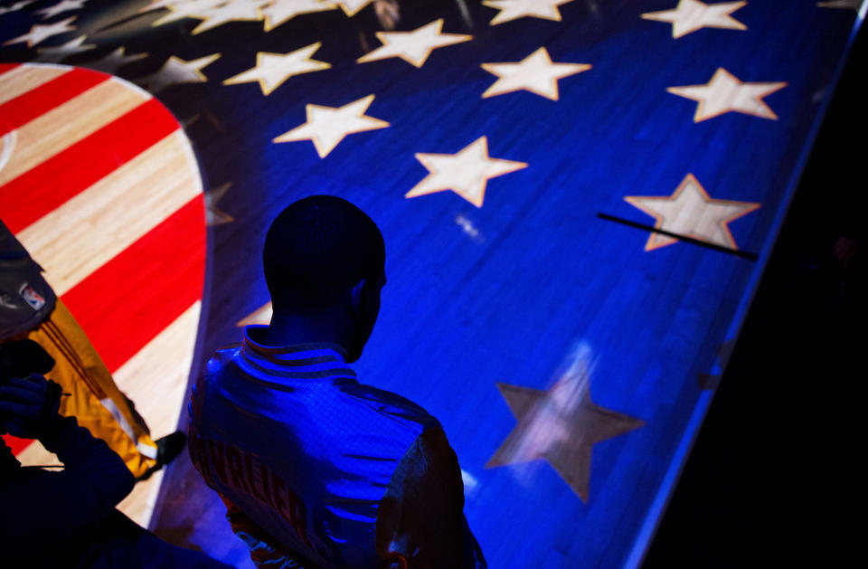 <p>Cleveland Cavaliers’ A.J. Price stands for the National Anthem before the start of an NBA basketball game against the Atlanta Hawks, Dec. 30, 2014, in Atlanta. (AP Photo/David Goldman) </p>