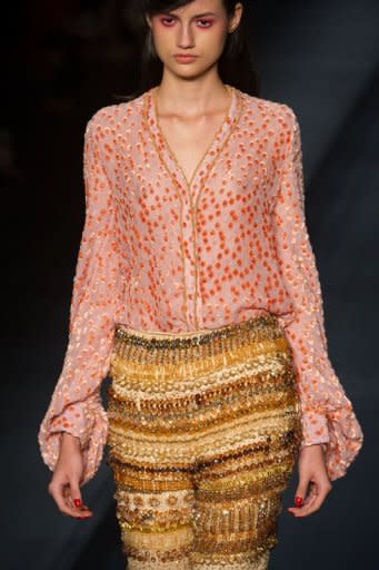 A model presents a creation by R.Rosner during the 2013 Winter collections of the Sao Paulo Fashion Week in Sao Paulo, Brazil, on October 31