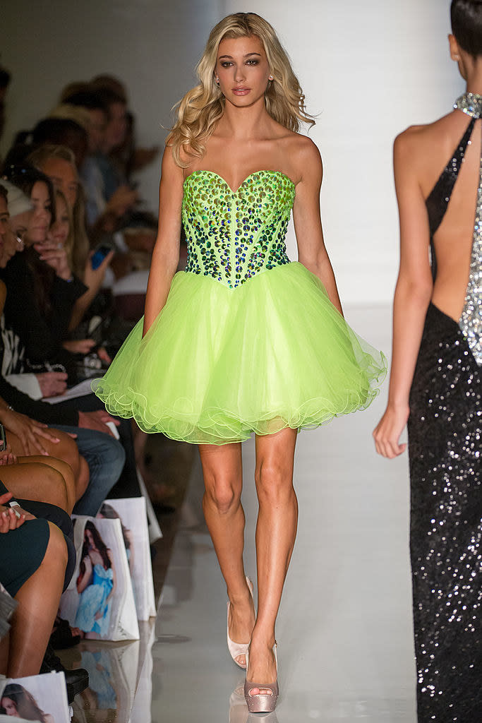 Hailey on the runway in a short, ballerina-type dress