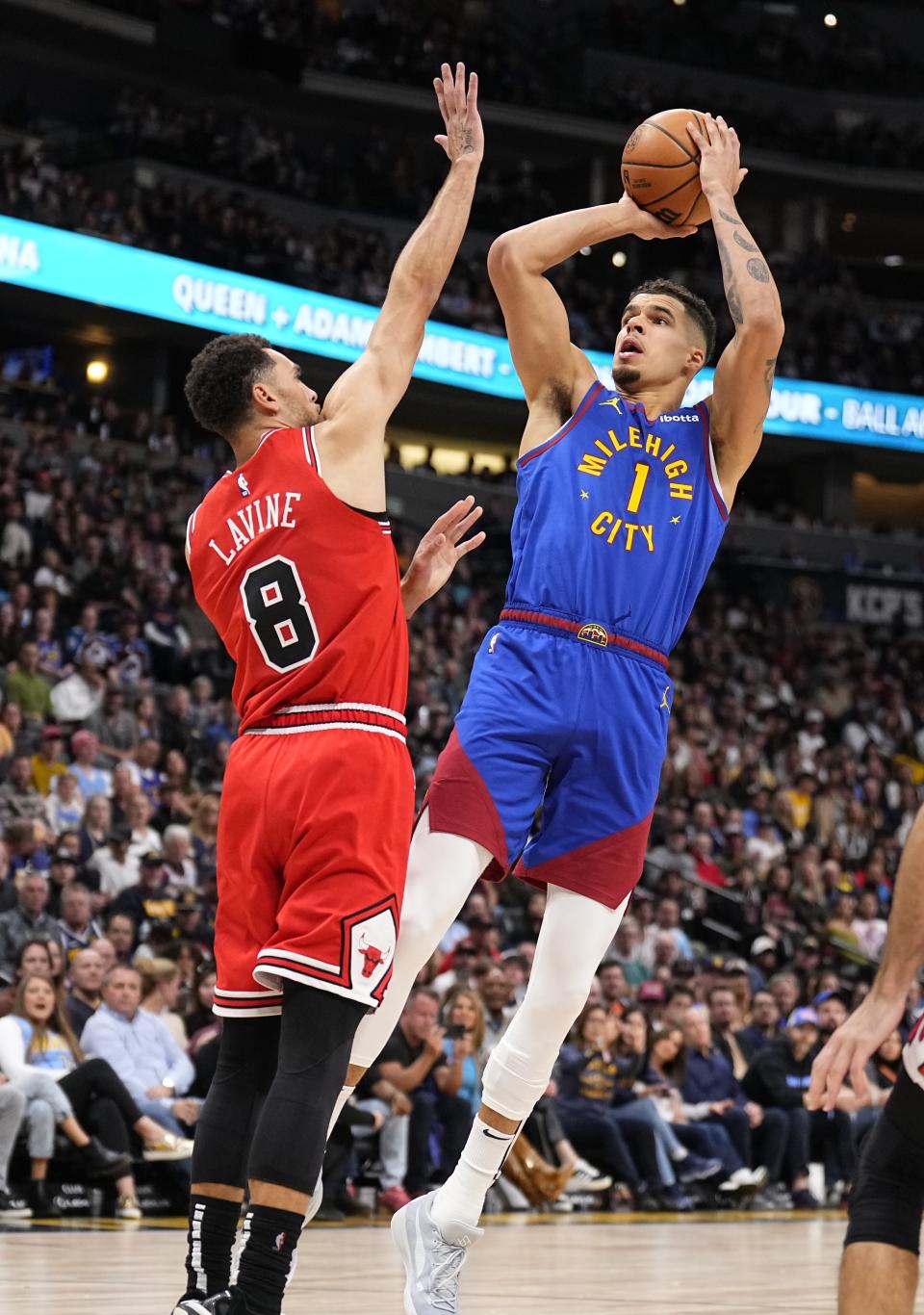 Denver Nuggets forward Michael Porter Jr. (1) shoots against Chicago Bulls guard Zach LaVine (8) during the second quarter of an NBA basketball game Saturday, Nov. 4, 2023, in Denver. (AP Photo/Jack Dempsey)