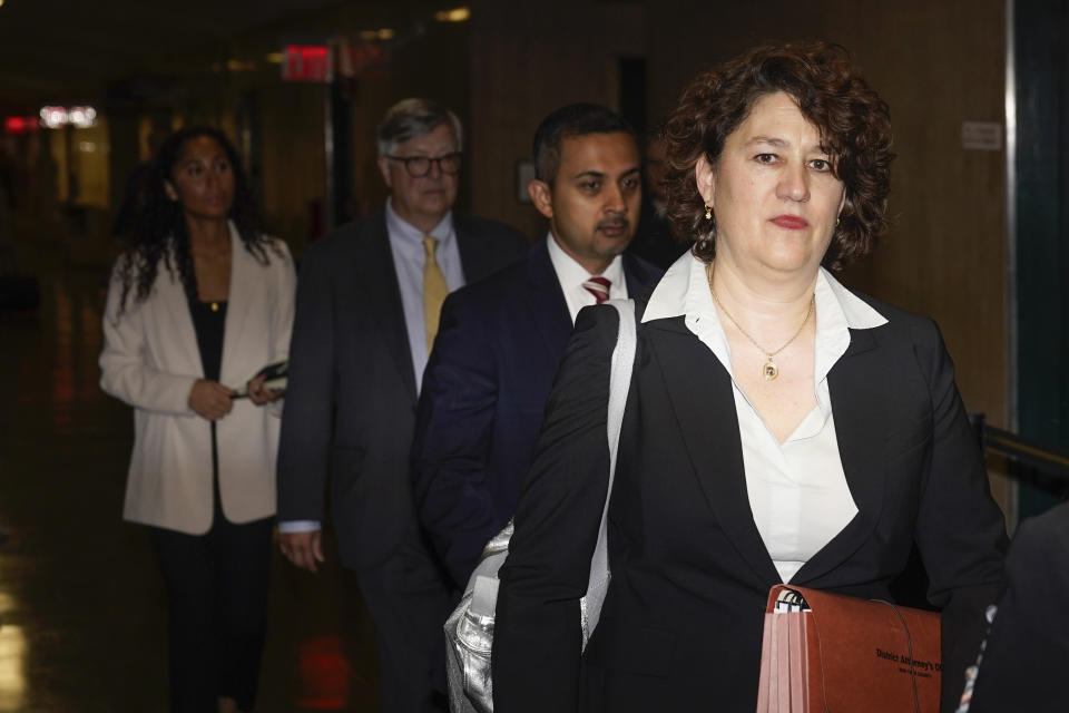 Prosecutor Susan Hoffinger, right, arrives to criminal court in New York, Tuesday, Nov. 1, 2022. The Trump Organization is on trial this week for criminal tax fraud. (AP Photo/Seth Wenig)