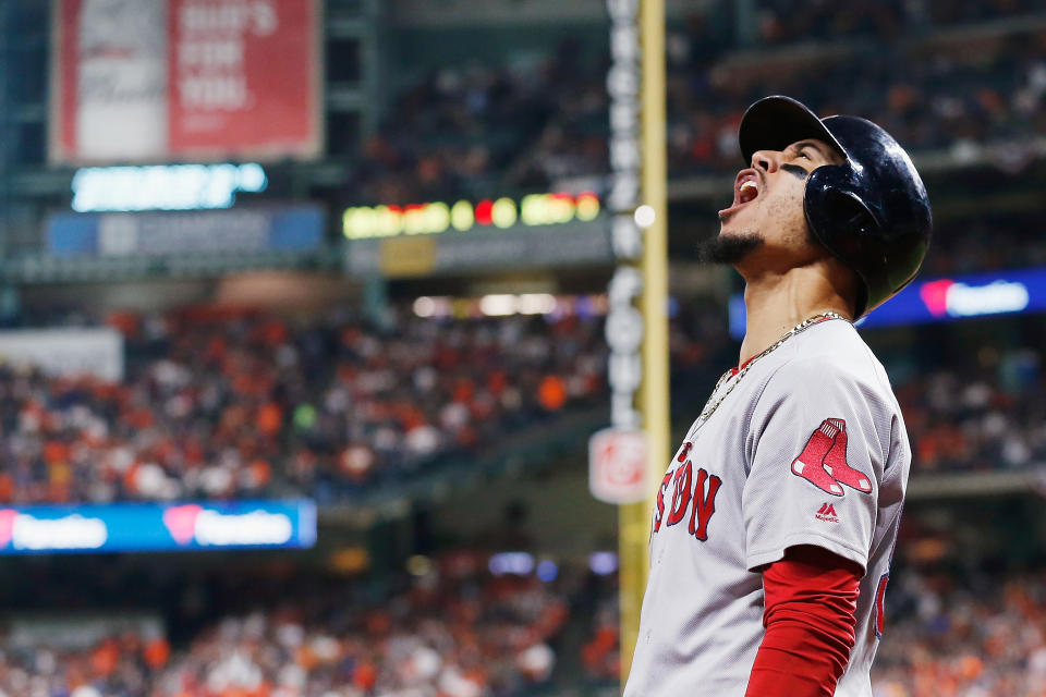 Boston Red Sox outfielder Mookie Betts celebrates after Jackie Bradley Jr. hit a two-run home run in the sixth inning against the Houston Astros. (Getty Images)