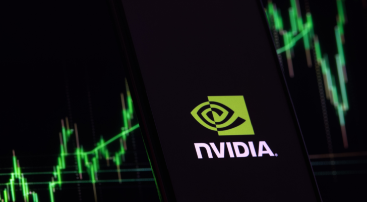 Nvidia (NVDA) investment growth and profit trading concept. Nvidia company logo on screen of smartphone against blurred background of up trading stock chart